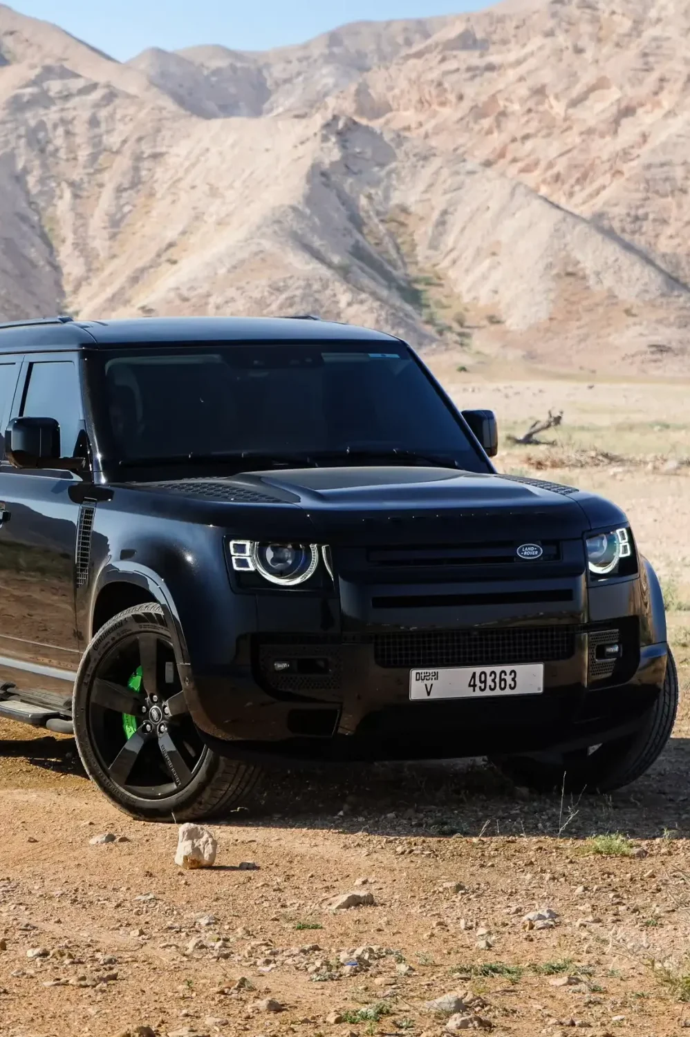 a picture of LAND ROVER DEFENDER 4 DOOR available for rental in dubai with front side view