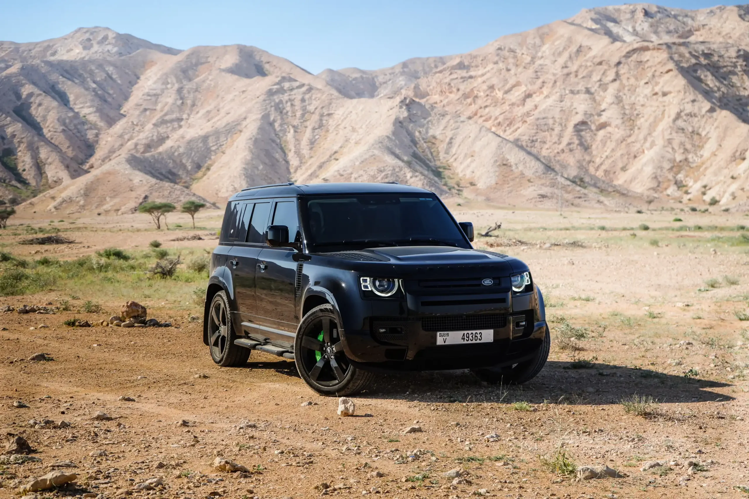 a picture of LAND ROVER DEFENDER 4 DOOR available for rental in dubai with front side view