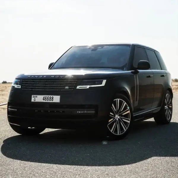 a picture of RANGE ROVER VOGUE available for rental in dubai parked in dessert view