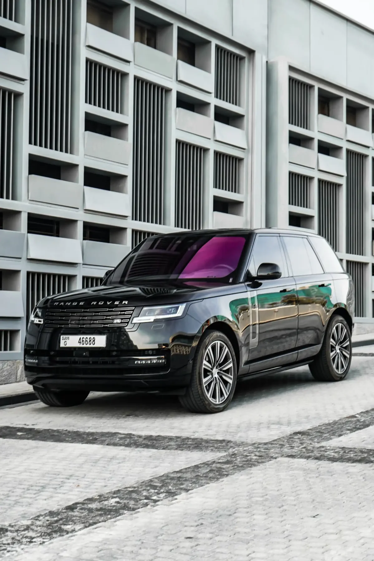 a picture of RANGE ROVER VOGUE available for rental in dubai with front side profile view