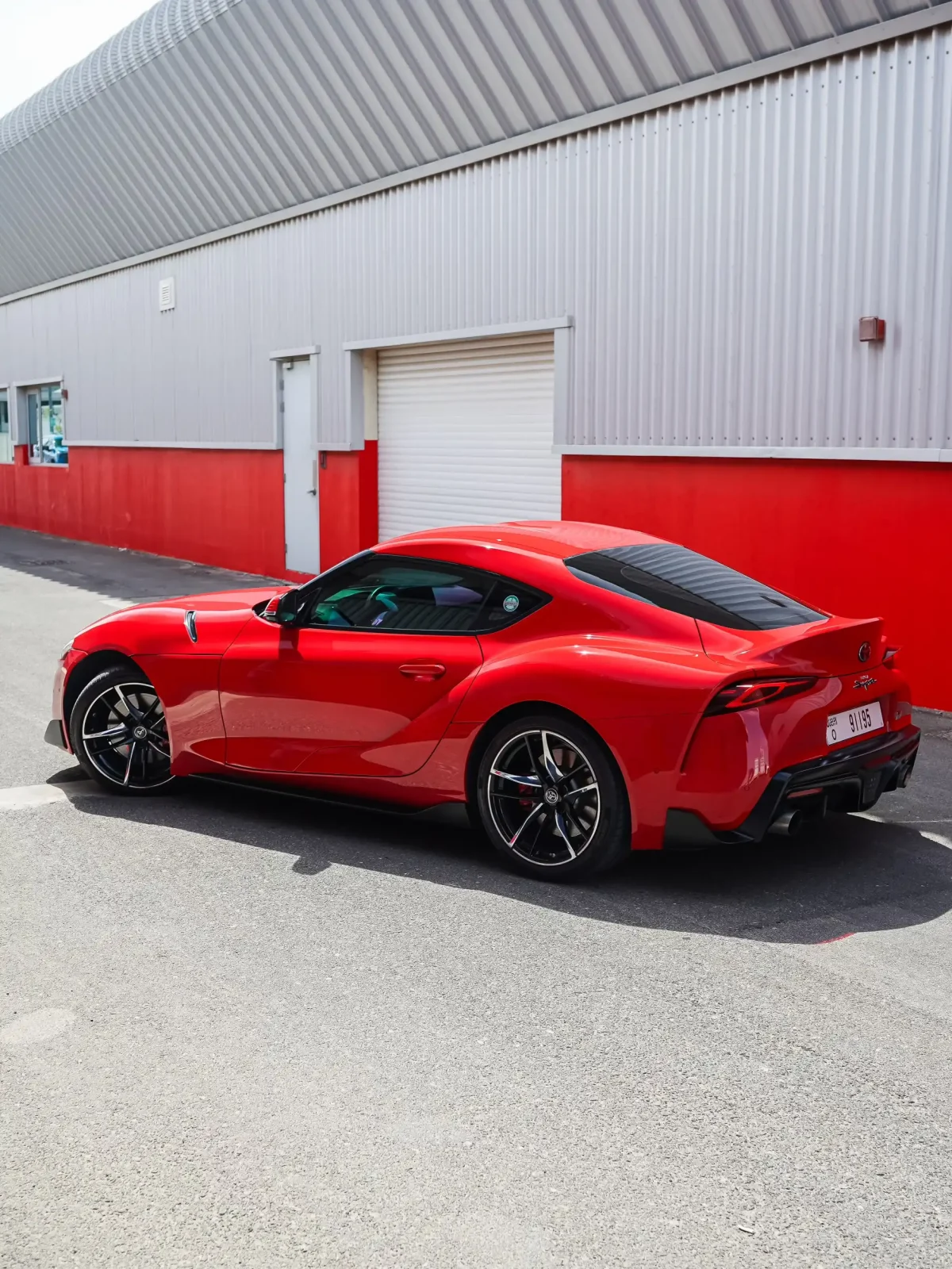 a picture of TOYOTA SUPRA GR available for rental in dubai with side profile view