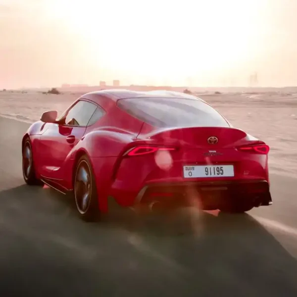 a picture of TOYOTA SUPRA GR available for rental in dubai with rear left tailgate view