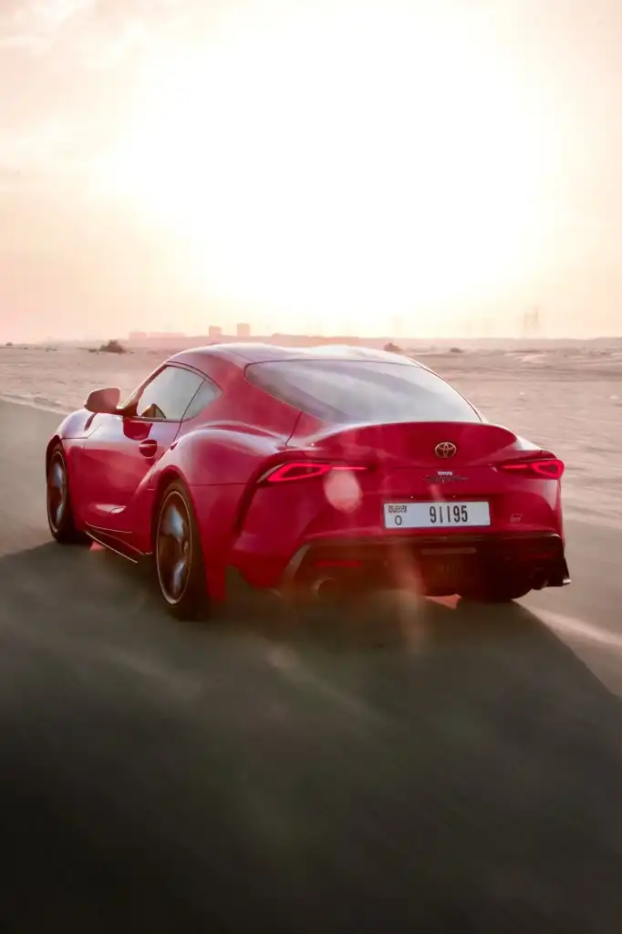 a picture of TOYOTA SUPRA GR available for rental in dubai with rear left tailgate view