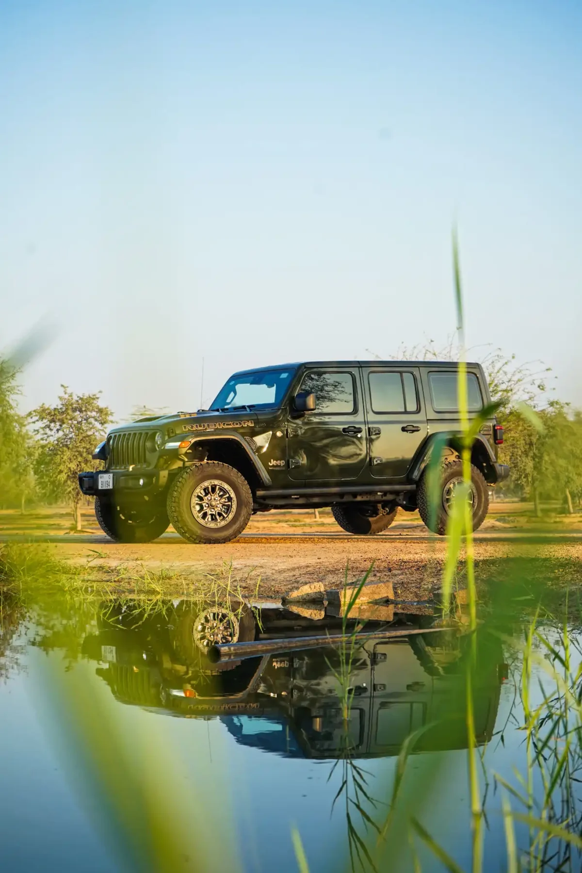 a picture of Jeep Wrangler available for rental in dubai with front side view