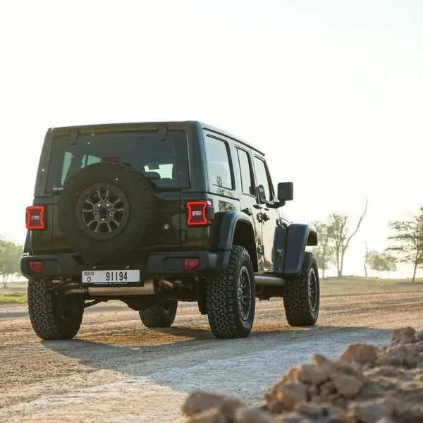 a picture of Jeep Wrangler available for rental in dubai with tail gate view