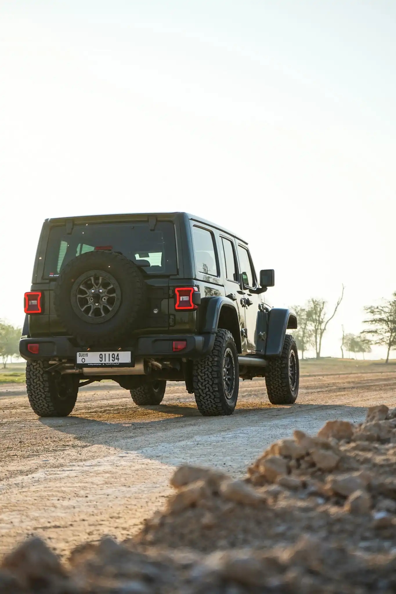 a picture of Jeep Wrangler available for rental in dubai with tail gate view