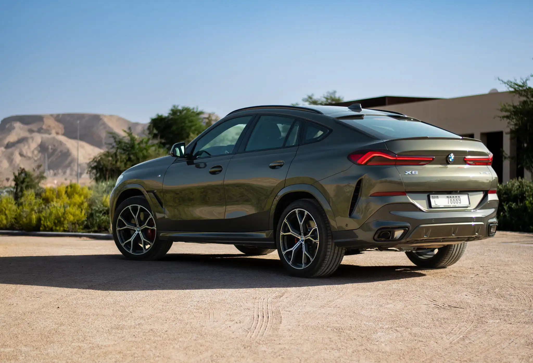 a picture of BMW X6 available for rental in dubai with rear side view