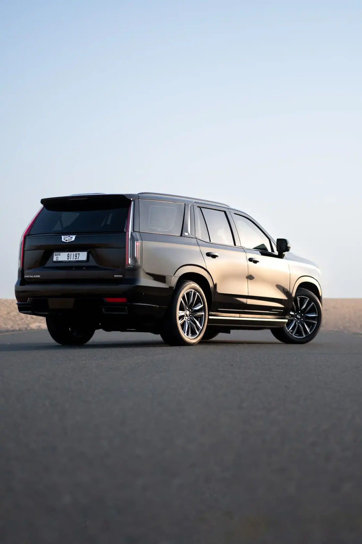 a picture of CADILLAC ESCALADE available for rental in dubai with rear view