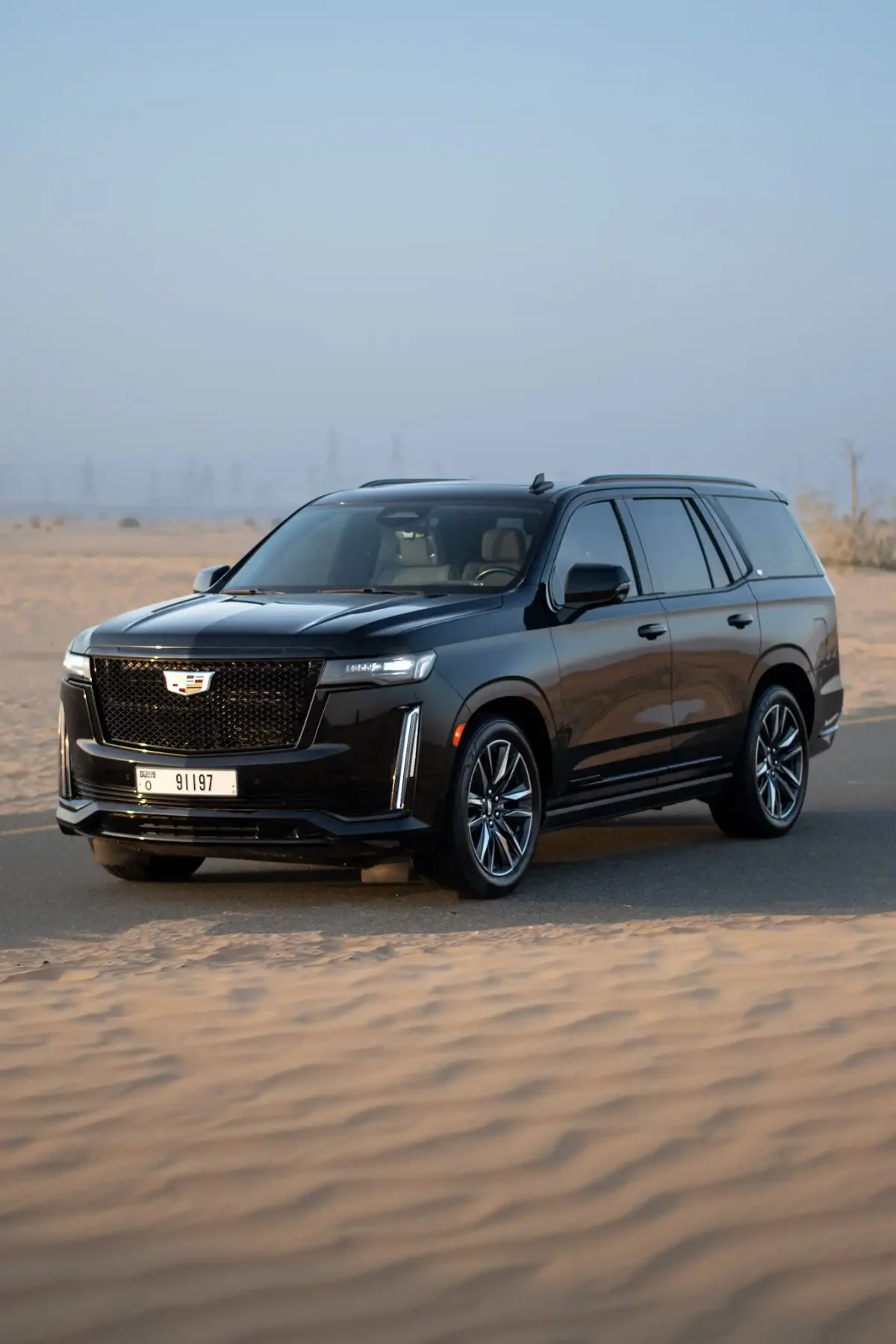 a picture of CADILLAC ESCALADE available for rental in dubai with front side view