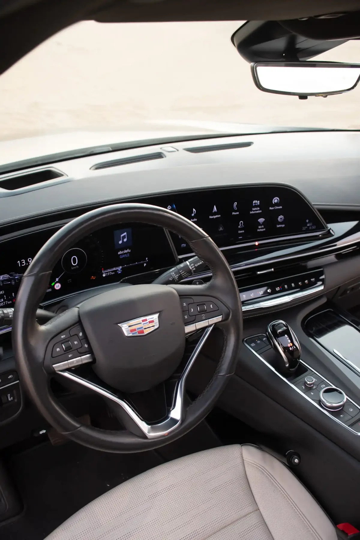 a picture of CADILLAC ESCALADE available for rental in dubai with central console view