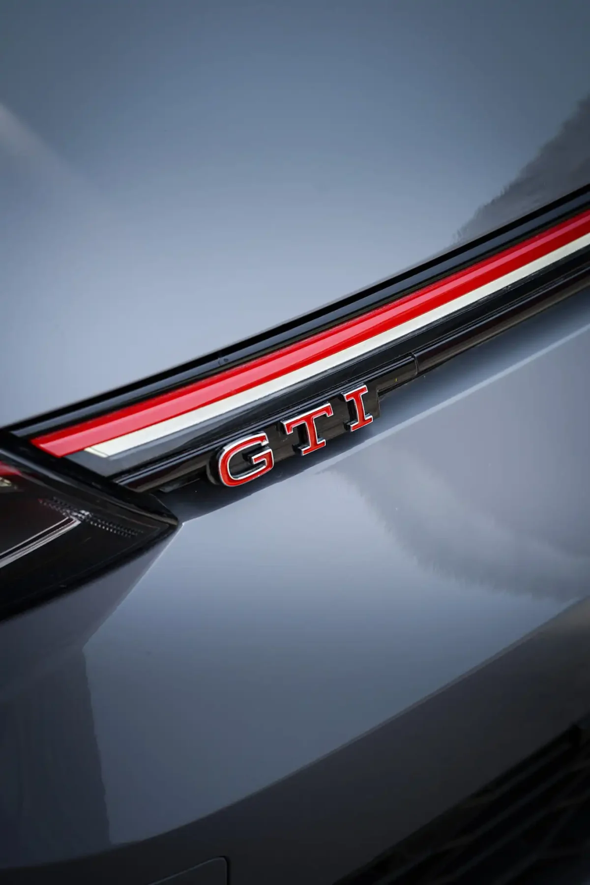 a picture of VOLKSWAGEN GOLF GTI available for rental in dubai with gti badge in front