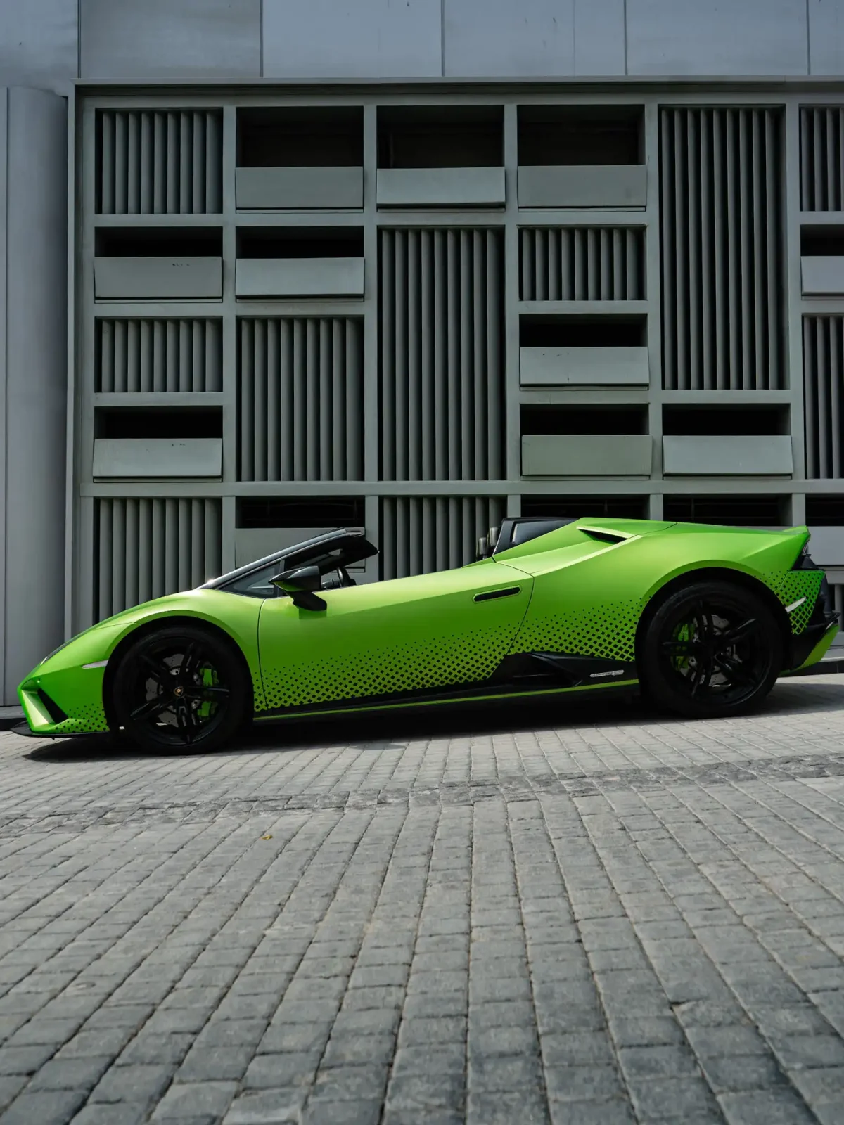 a picture of LAMBORGHINI HURACAN EVO SPYDER available for rental in dubai with side profile view