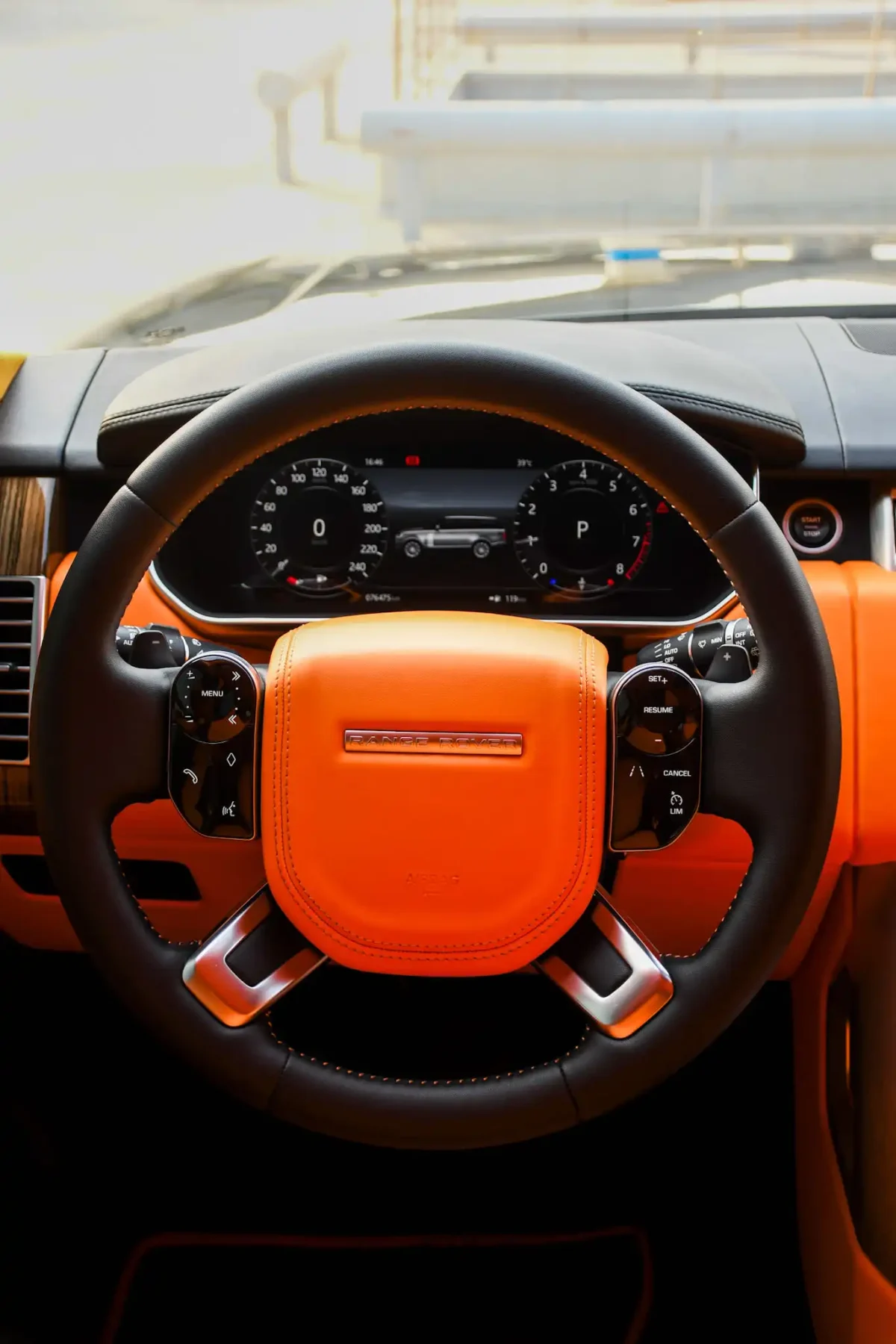 a picture of RANGE ROVER VOGUE available for rental in dubai with driver side console and steering view