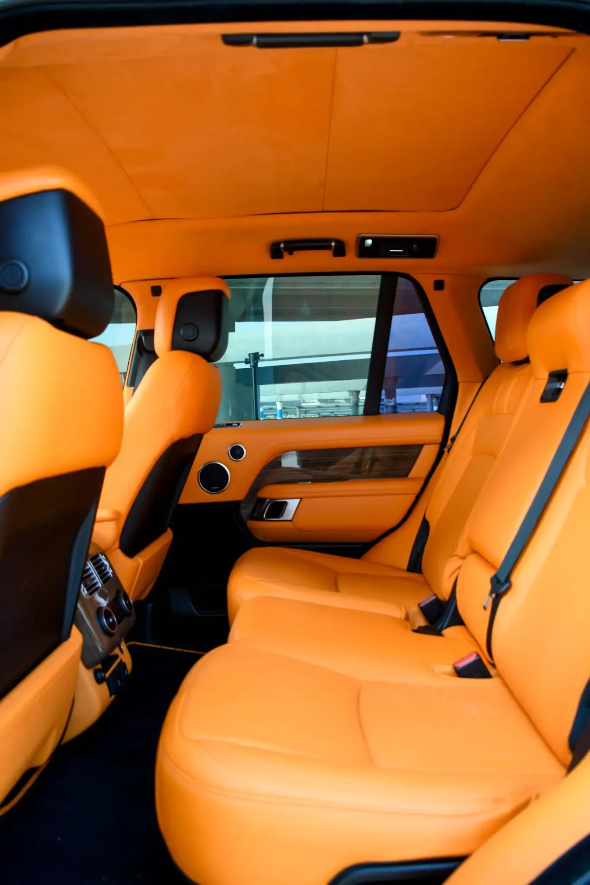 a picture of RANGE ROVER VOGUE available for rental in dubai with orange interios