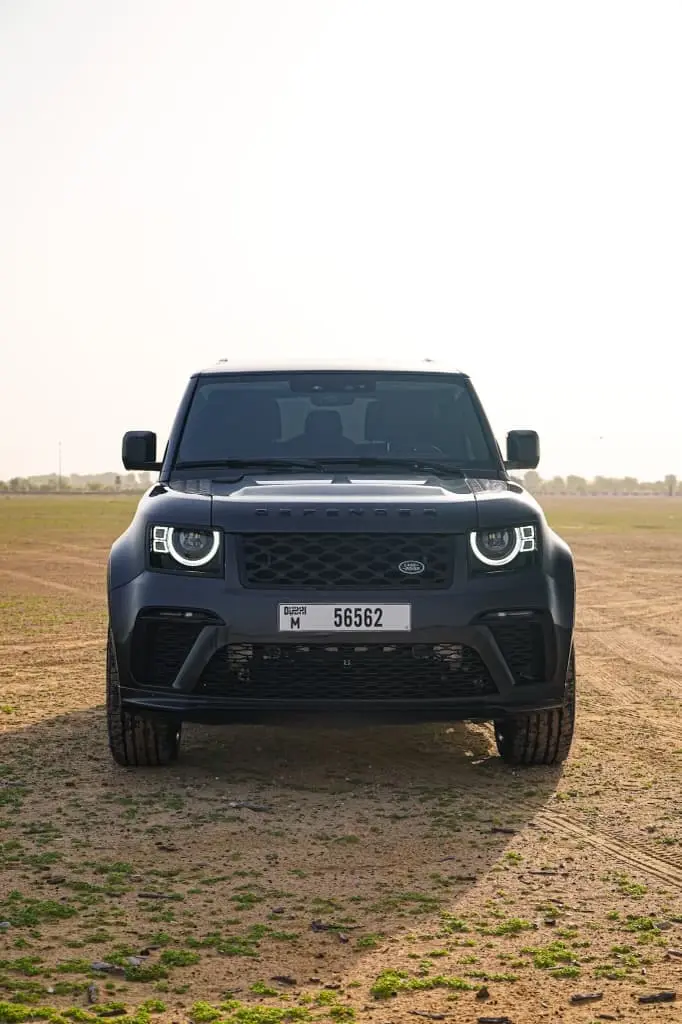 a picture of Land Rover Defender 2 Door with Wide Bodykit available for rental upfront view with led drl