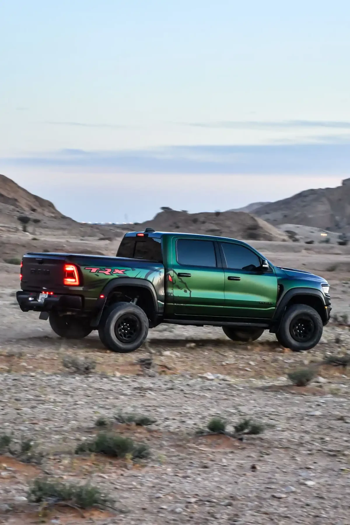 a picture of Dodge Trx 6.2L Venom Green edition available for rental in dubai with side profile view