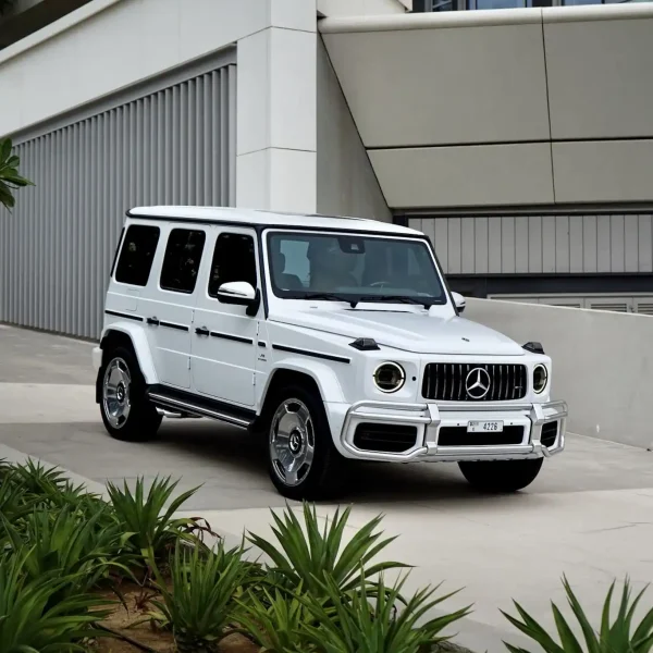 a picture of Mercedes G63 Matte White parked outside available for rental