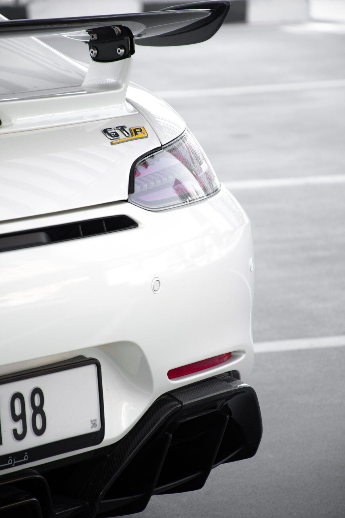 a picture of Mercedes AMG GTR with tail light view