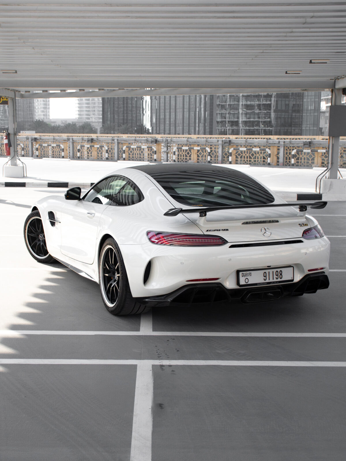 a picture of Mercedes AMG GTR with back side profile view